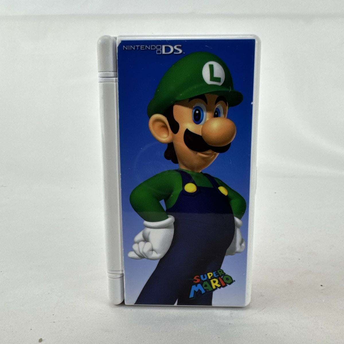 Nintendo DS white plastic clamshell 12 game card case featuring Luigi artwork.