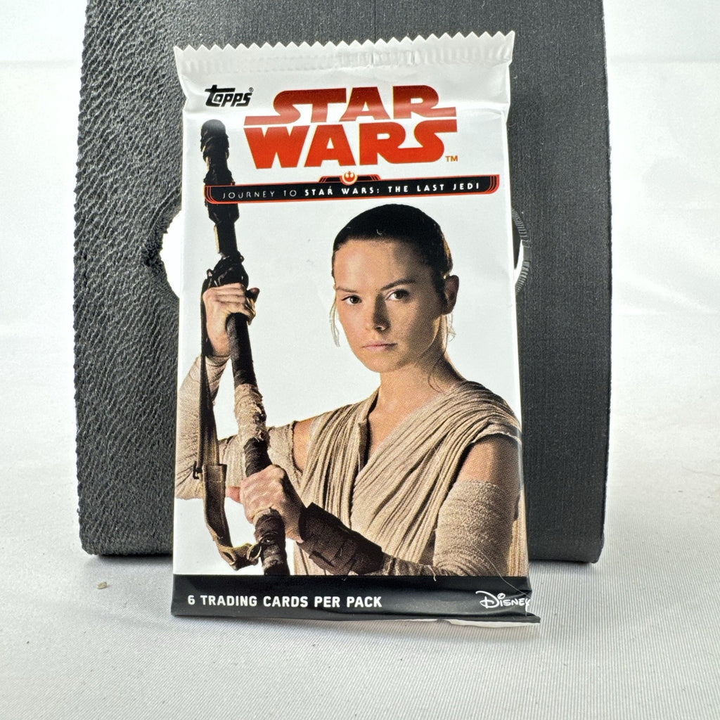 Sealed 2017 Topps Star Wars Journey to The Last Jedi booster pack featuring Rey front wrapper art