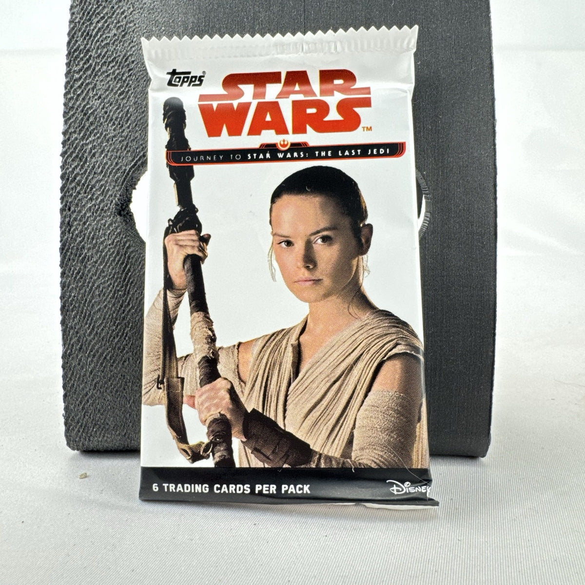 Sealed 2017 Topps Star Wars Journey to The Last Jedi booster pack featuring Rey front wrapper art