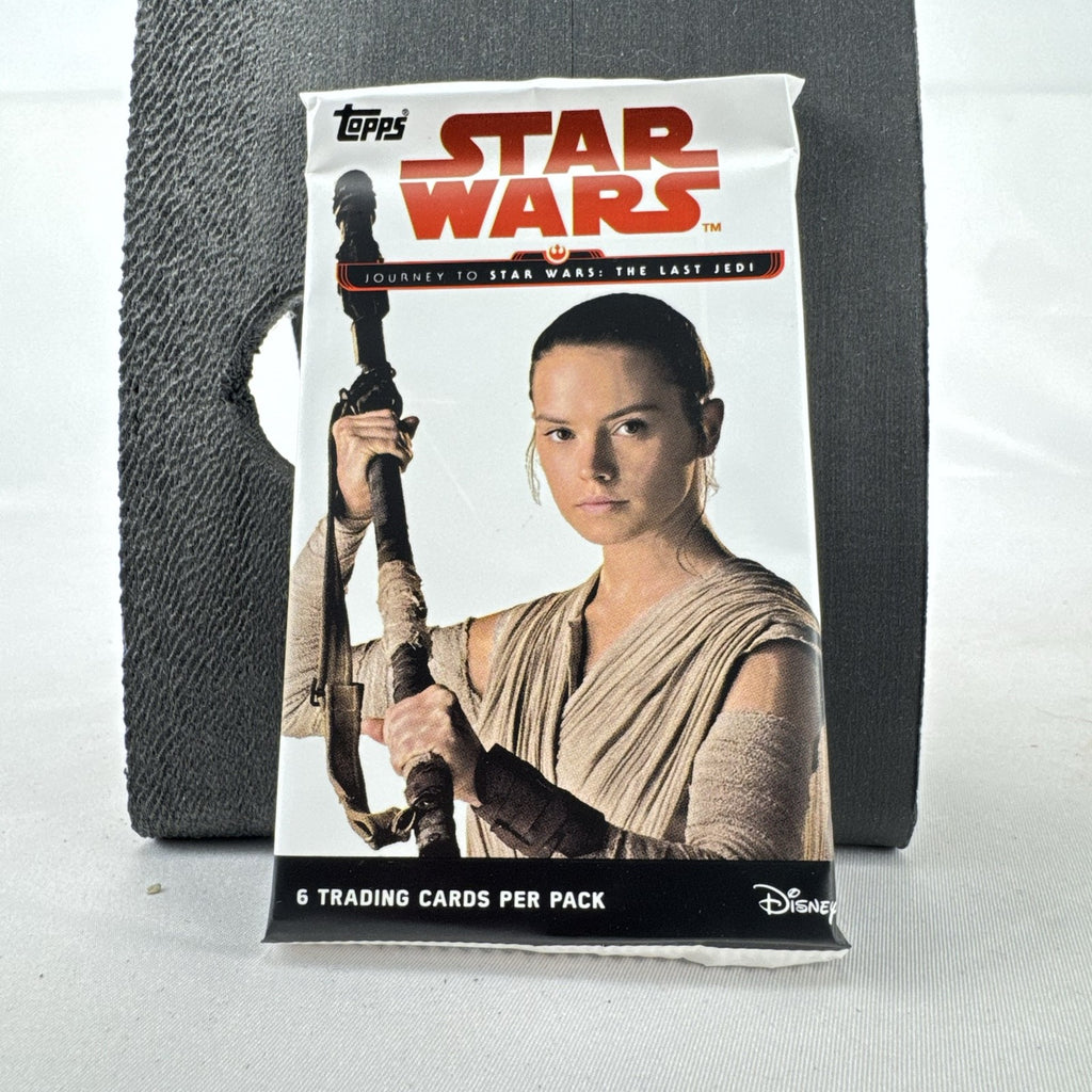 Sealed 2017 Topps Star Wars Journey to The Last Jedi foil pack featuring Rey wrapper art with 6 cards