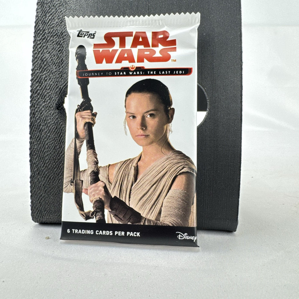 Sealed 2017 Topps Star Wars Journey to The Last Jedi foil pack featuring Rey wrapper art