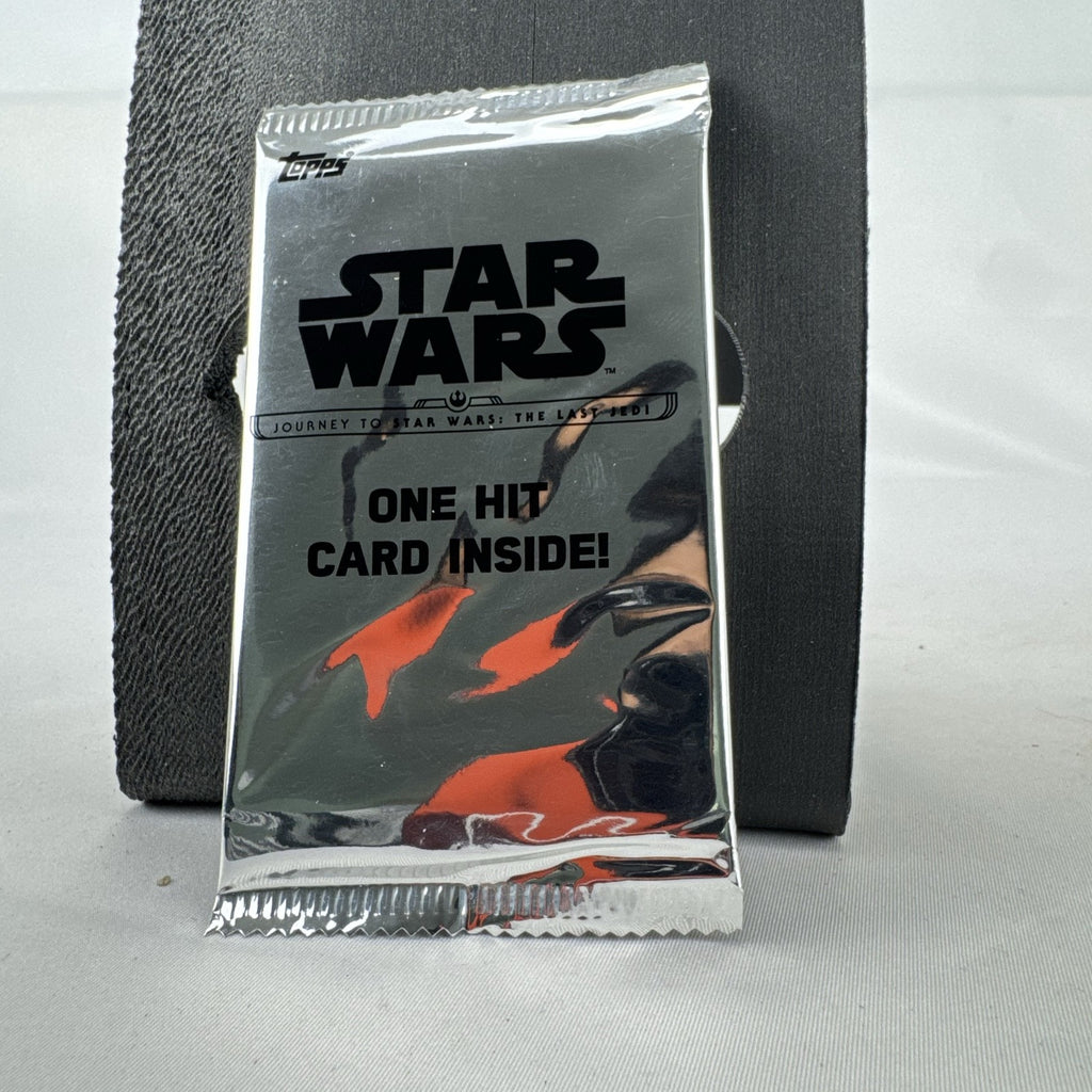 Factory-sealed 2017 Topps Journey to Star Wars: The Last Jedi silver foil hit pack guaranteeing one card