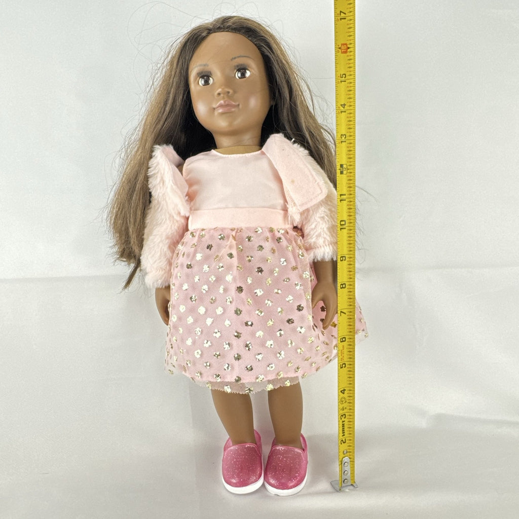 American Girl Truly Me 18-inch doll with dark skin and brown hair wearing a pink sparkle party dress and shrug