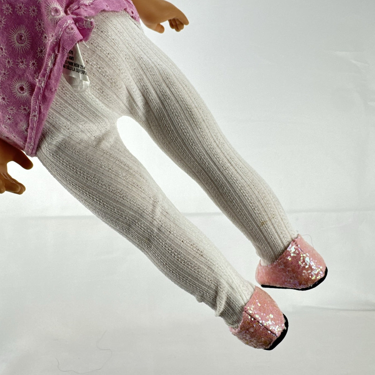 Cititoy 18-inch vinyl girl doll with blonde hair updo, green eyes, freckles, and pink floral outfit with glitter shoes.