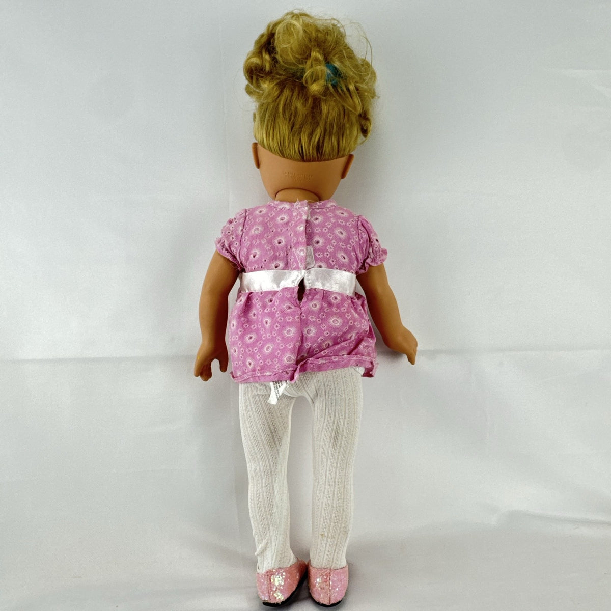Cititoy 18-inch vinyl girl doll with blonde hair updo, green eyes, freckles, and pink floral outfit with glitter shoes.