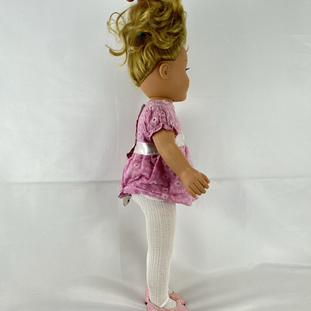 Cititoy 18-inch vinyl girl doll with blonde hair updo, green eyes, freckles, and pink floral outfit with glitter shoes.