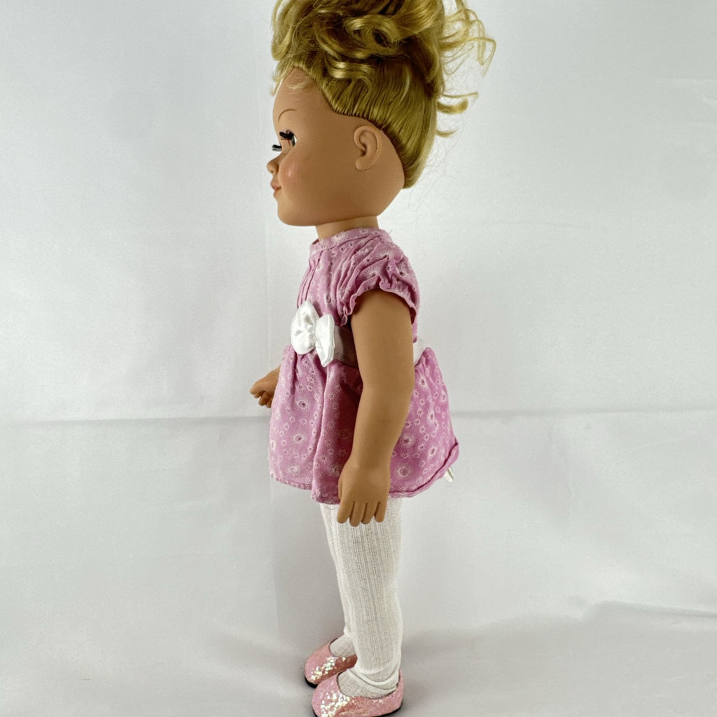 Cititoy 18-inch vinyl girl doll with blonde hair updo, green eyes, freckles, and pink floral outfit with glitter shoes.