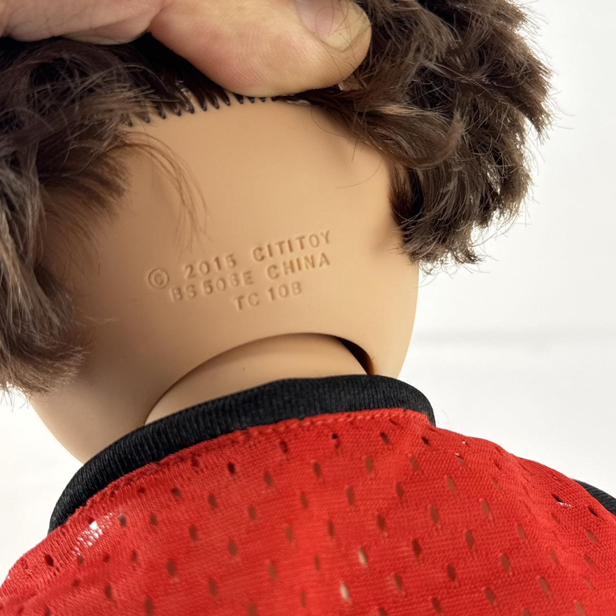 Cititoy 18-inch vinyl boy play doll with blue eyes and brown hair wearing a red basketball jersey and sneakers