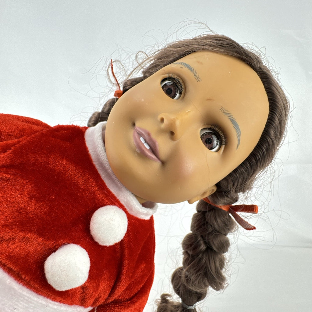 Battat Our Generation 18-inch doll with brown braided pigtails wearing a red and white holiday Santa dress and boots