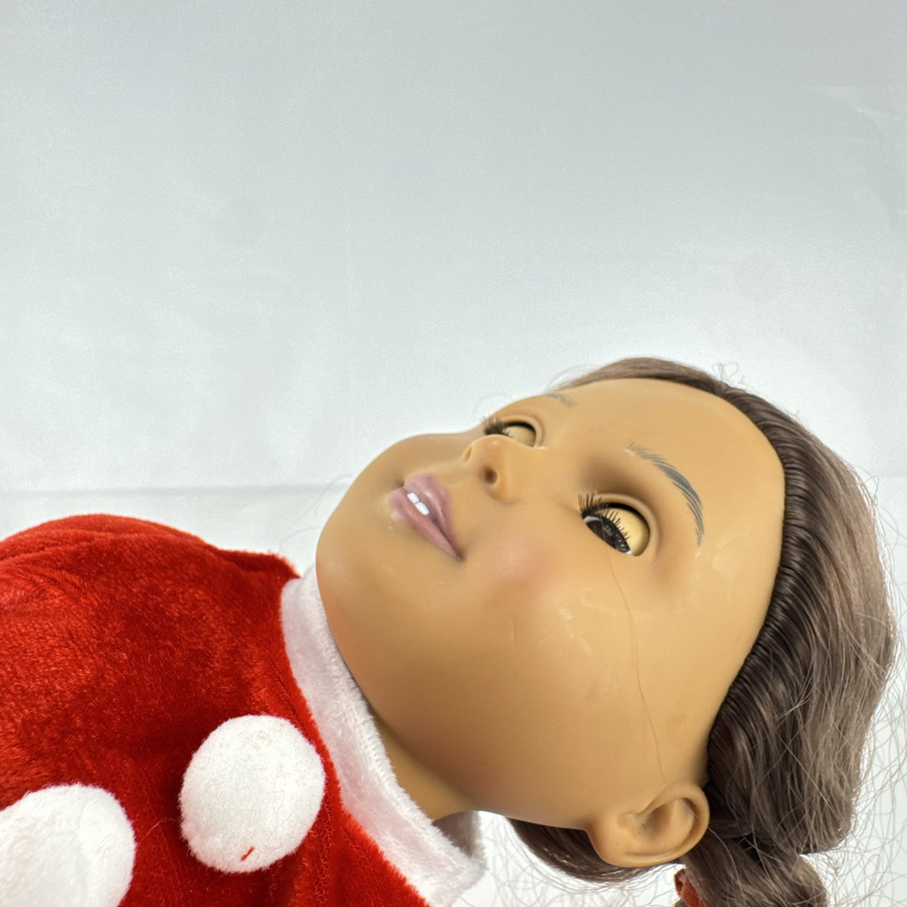 Battat Our Generation 18-inch doll with brown braided pigtails wearing a red and white holiday Santa dress and boots