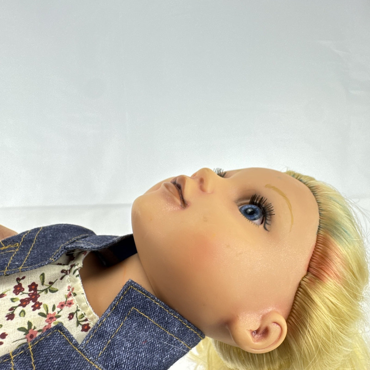 Geoffrey LLC Journey Girls 18-inch doll with blonde rainbow-streaked hair, floral dress, and denim jacket.