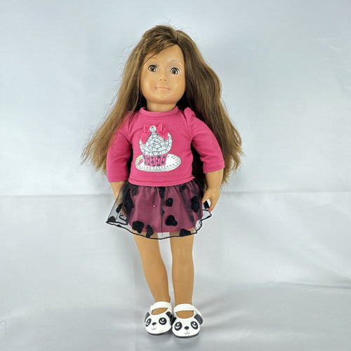 Battat Our Generation 18-inch brunette play doll wearing a pink cupcake shirt, tulle skirt, and panda shoes.