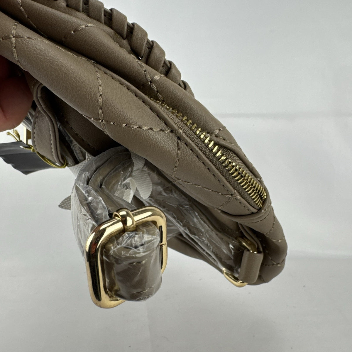 bebe Julia mini backpack purse in taupe quilted faux leather with gold chain trim and original tags