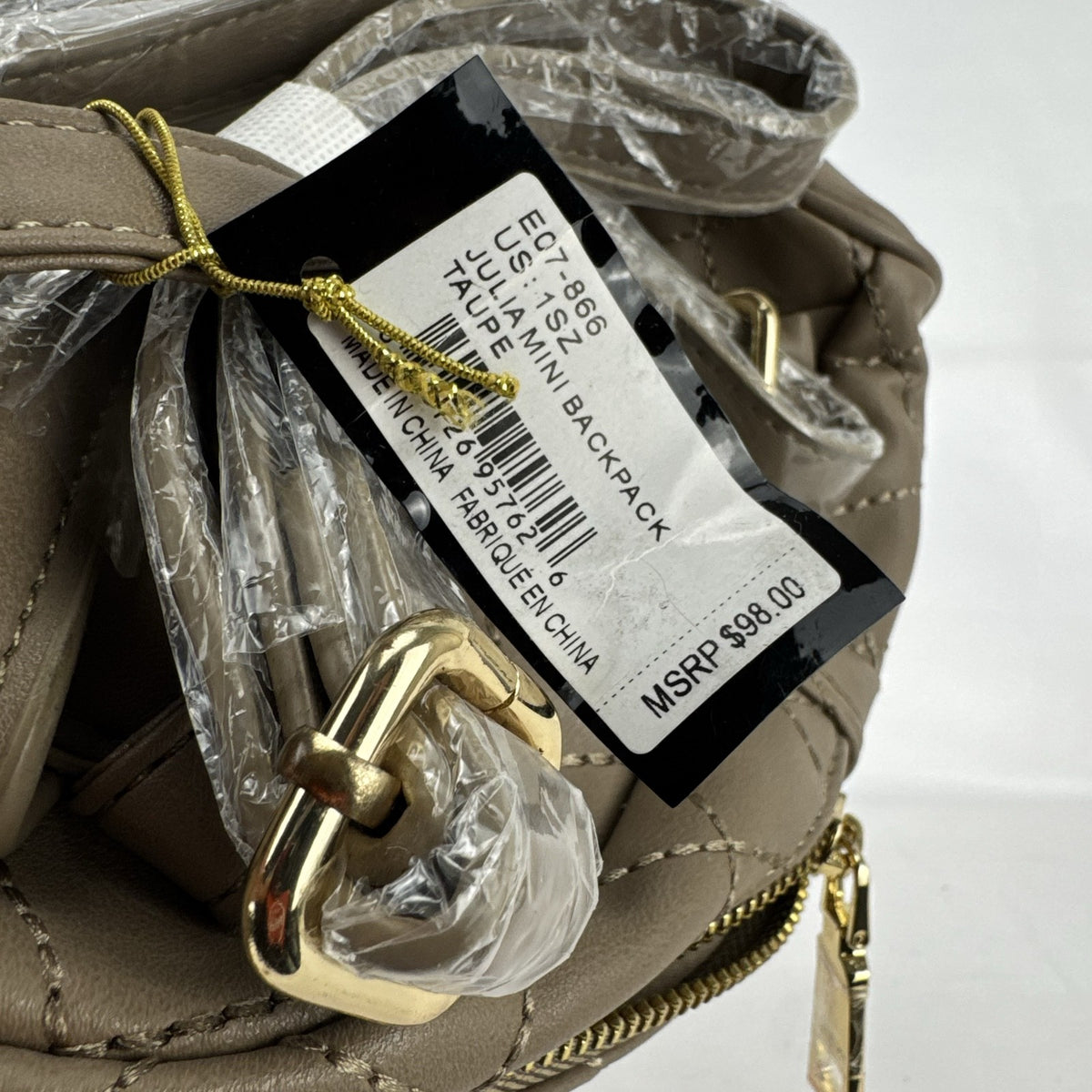 bebe Julia mini backpack purse in taupe quilted faux leather with gold chain trim and original tags