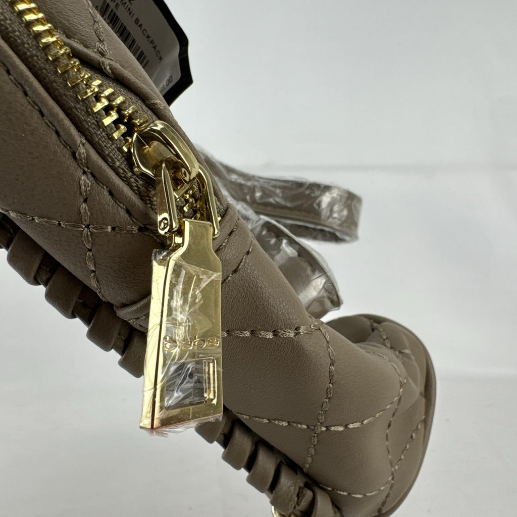 bebe Julia mini backpack purse in taupe quilted faux leather with gold chain trim and original tags