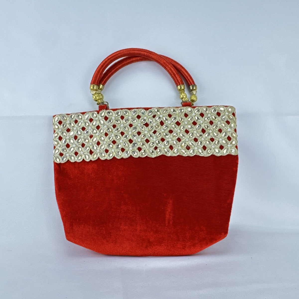Red velvet top handle evening handbag with ornate gold-tone rhinestone and bead embellishments