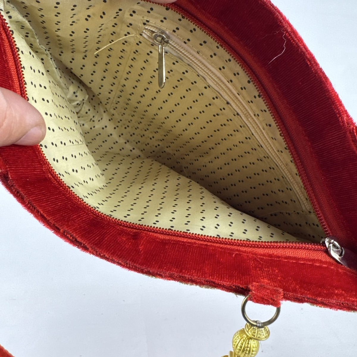 Red velvet top handle evening handbag with ornate gold-tone rhinestone and bead embellishments