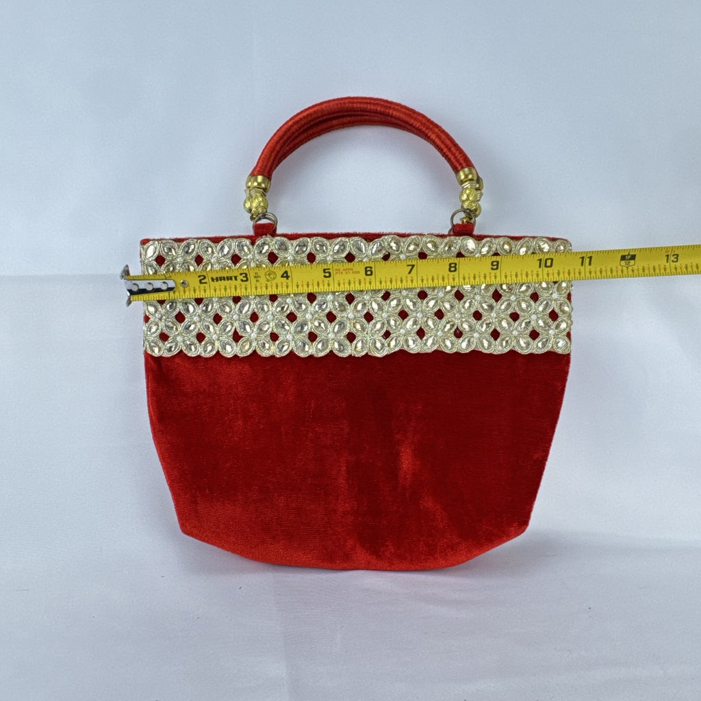 Red velvet top handle evening handbag with ornate gold-tone rhinestone and bead embellishments