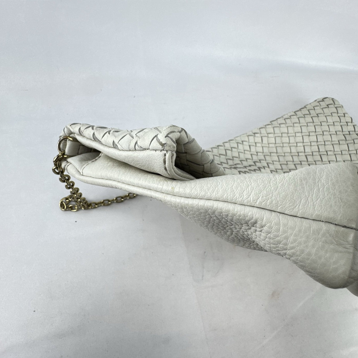 Banana Republic white pebbled leather foldover clutch with woven flap and gold chain strap