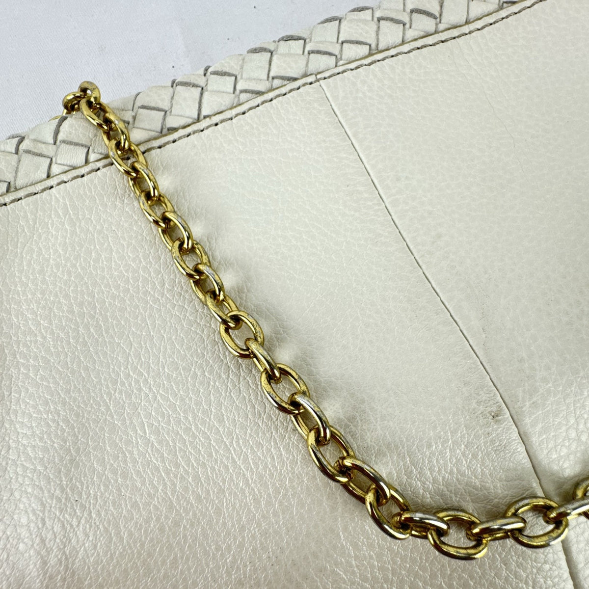 Banana Republic white pebbled leather foldover clutch with woven flap and gold chain strap