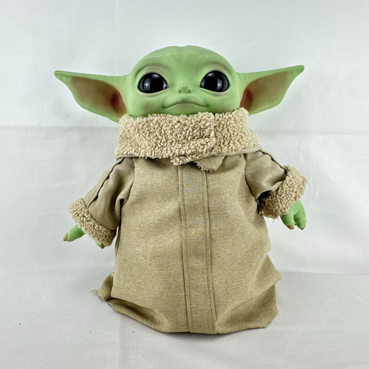 Mattel Star Wars Grogu 11-inch plush figure with sculpted vinyl head and tan faux-shearling robe