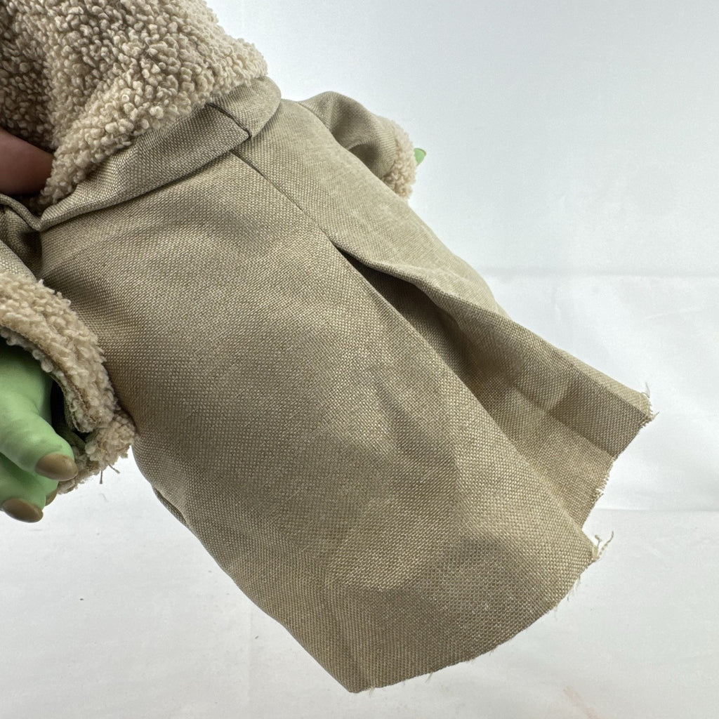 Mattel Star Wars Grogu 11-inch plush figure with sculpted vinyl head and tan faux-shearling robe