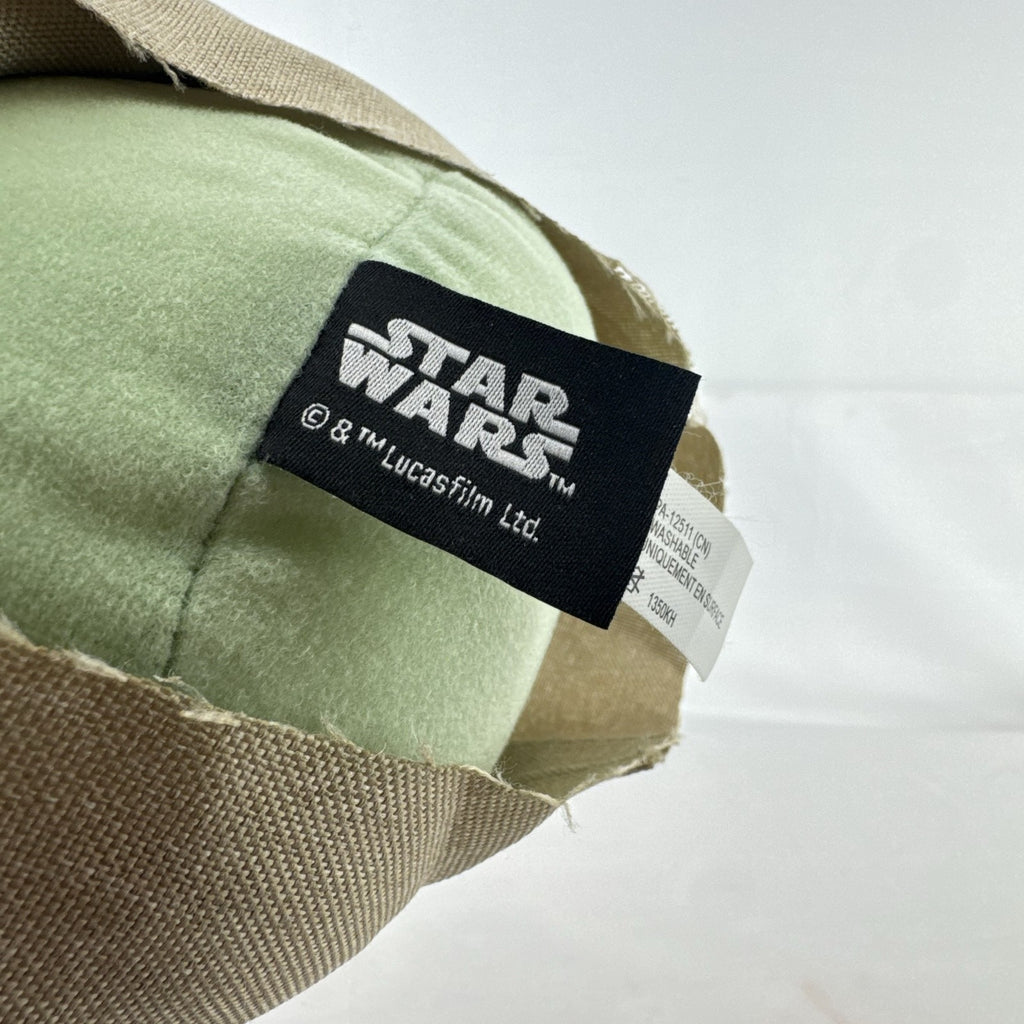 Mattel Star Wars Grogu 11-inch plush figure with sculpted vinyl head and tan faux-shearling robe