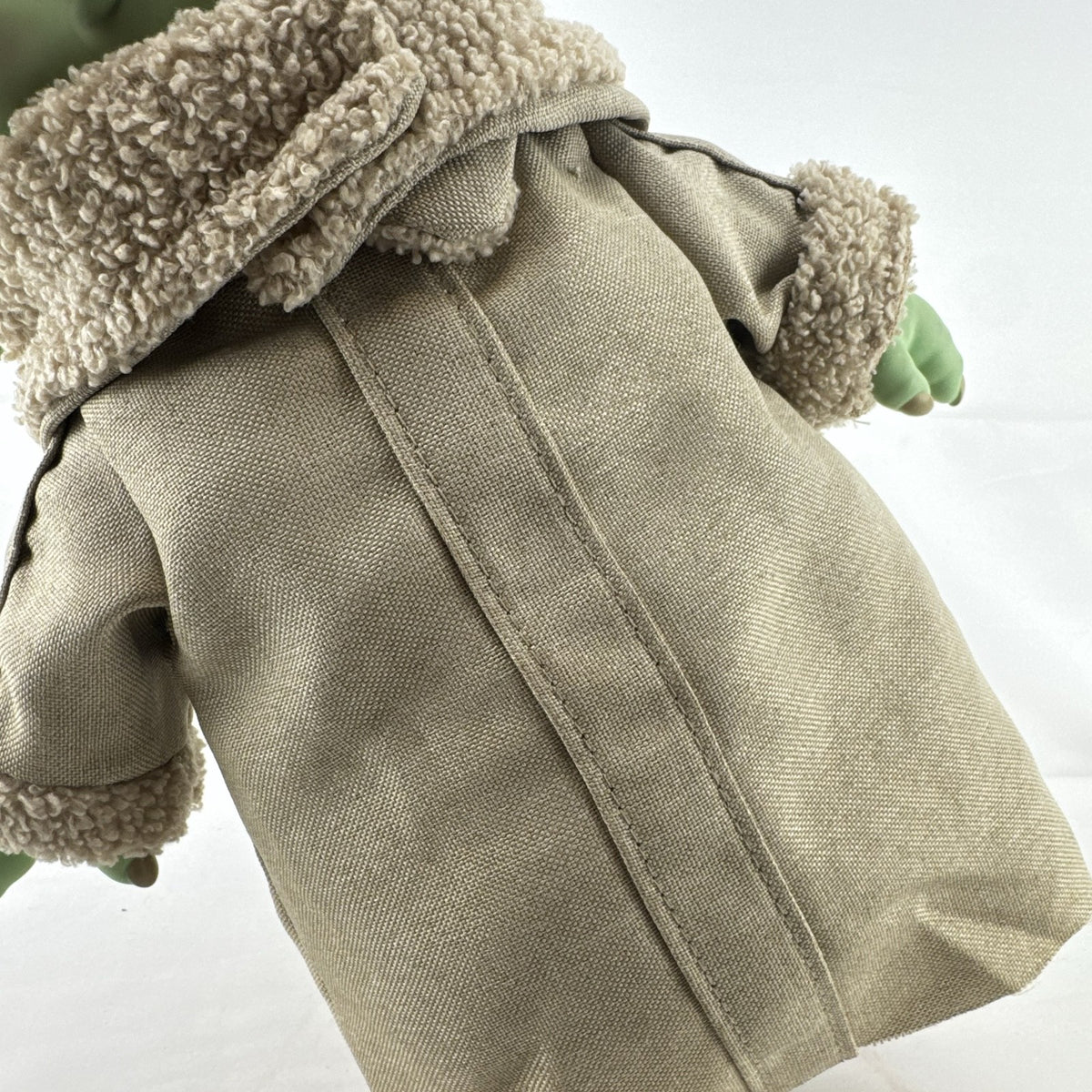 Mattel Star Wars Grogu 11-inch plush figure with sculpted vinyl head and tan faux-shearling robe