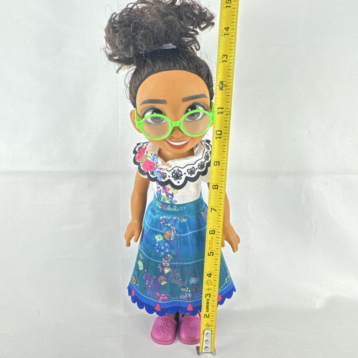 JAKKS Pacific Disney Encanto Mirabel Madrigal 14-inch doll with green glasses and patterned dress