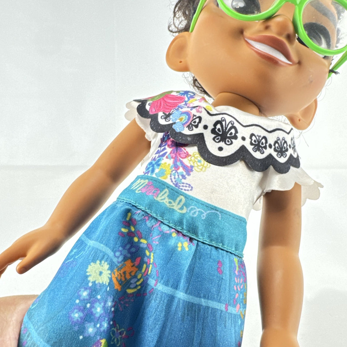 JAKKS Pacific Disney Encanto Mirabel Madrigal 14-inch doll with green glasses and patterned dress
