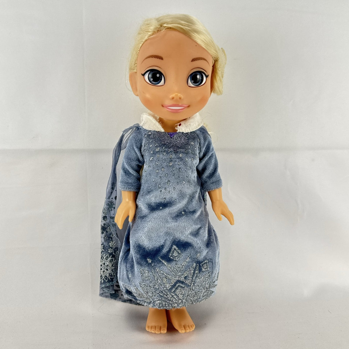 JAKKS Pacific Disney Frozen Elsa 13-inch toddler doll wearing blue winter dress with faux fur trim