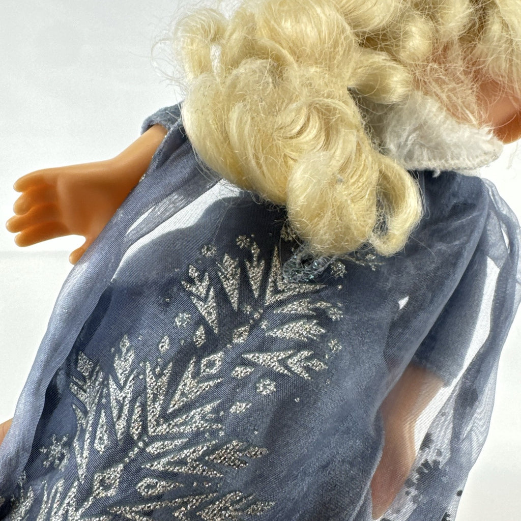 JAKKS Pacific Disney Frozen Elsa 13-inch toddler doll wearing blue winter dress with faux fur trim