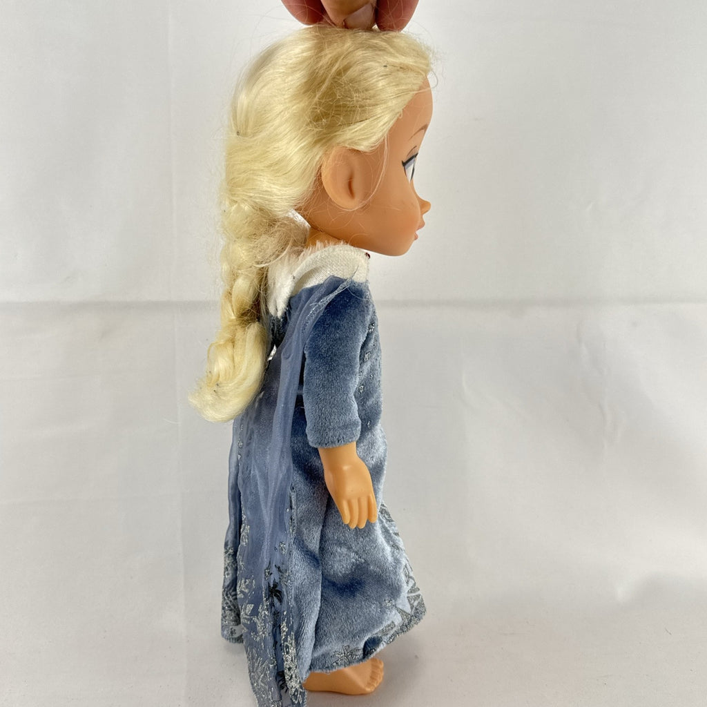JAKKS Pacific Disney Frozen Elsa 13-inch toddler doll wearing blue winter dress with faux fur trim
