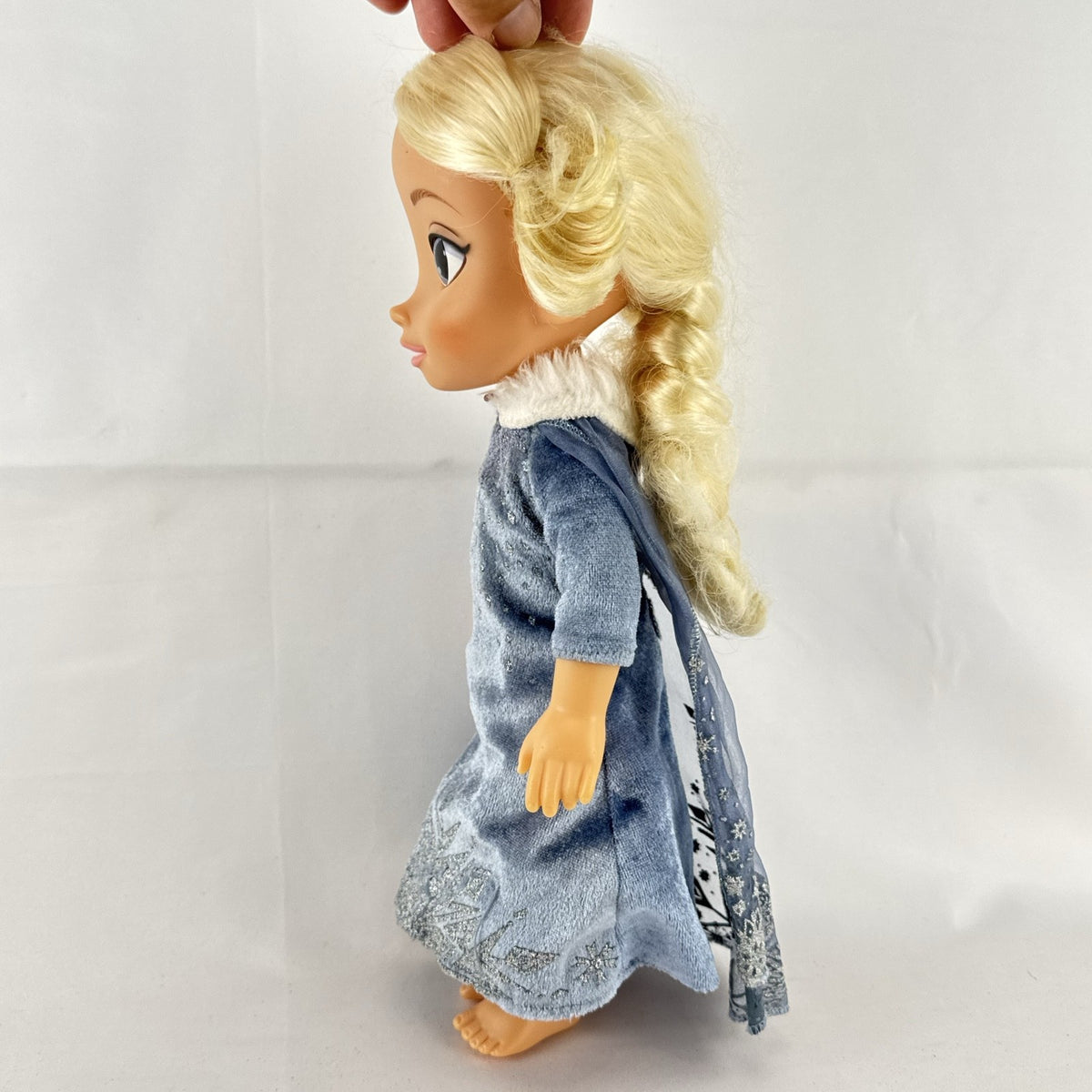 JAKKS Pacific Disney Frozen Elsa 13-inch toddler doll wearing blue winter dress with faux fur trim