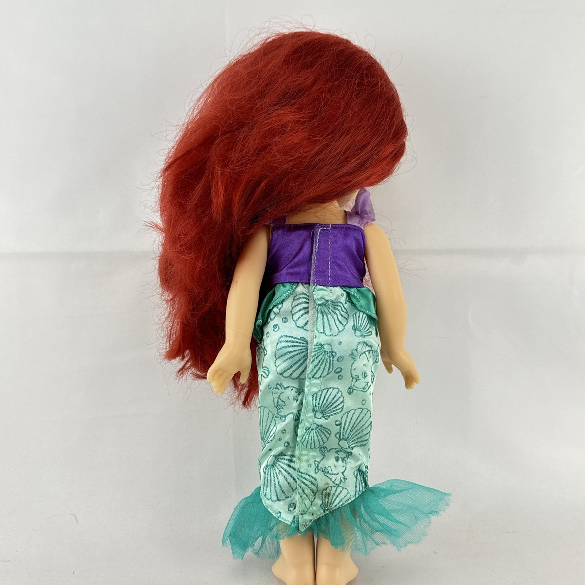 Disney Princess Ariel 13-inch vinyl toddler play doll wearing teal and purple mermaid dress