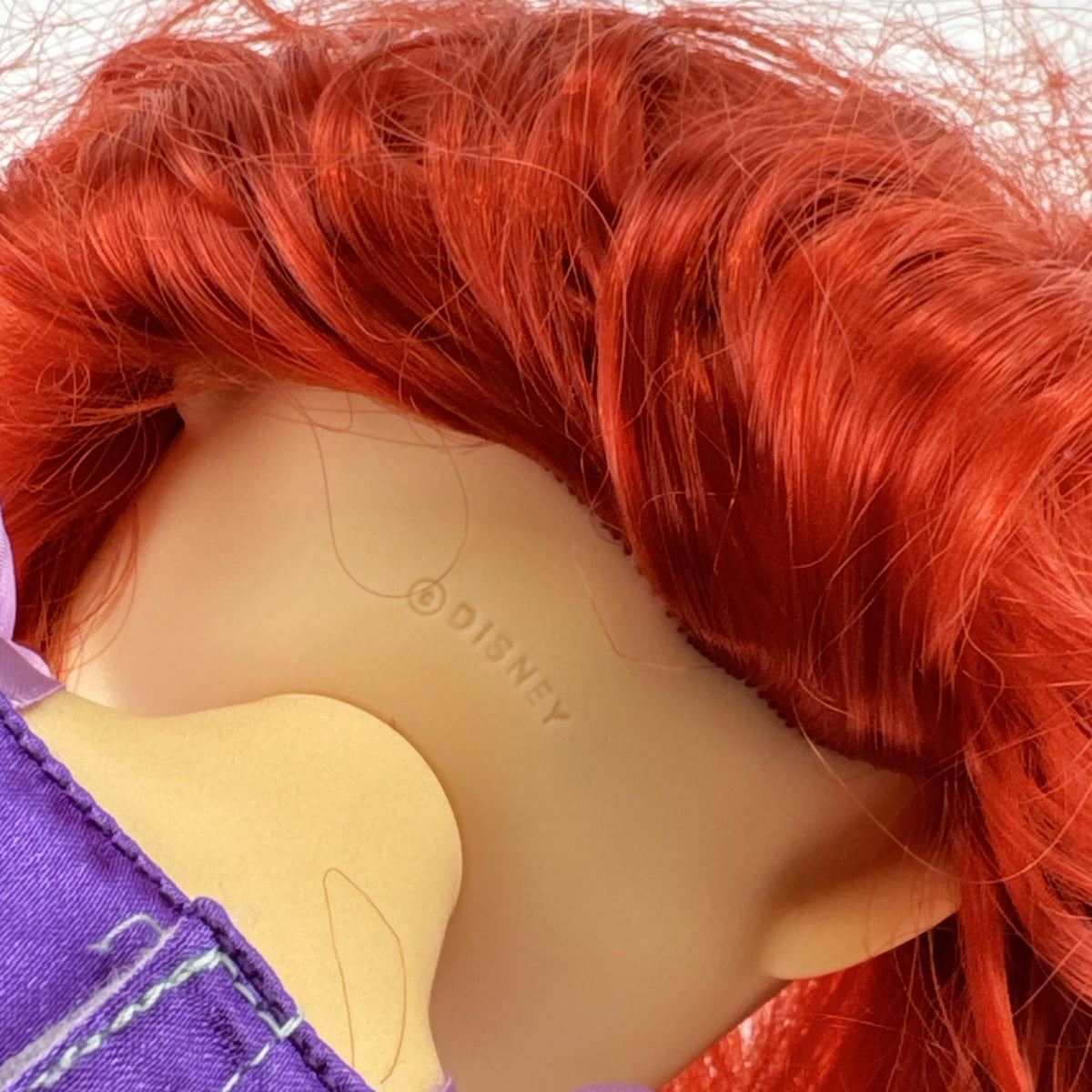 Disney Princess Ariel 13-inch vinyl toddler play doll wearing teal and purple mermaid dress