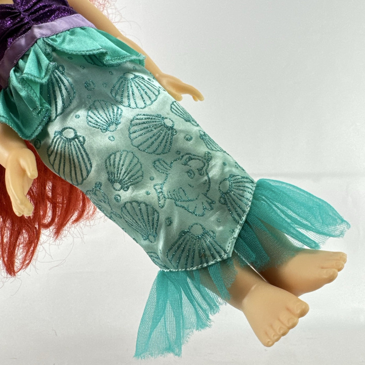 Disney Princess Ariel 13-inch vinyl toddler play doll wearing teal and purple mermaid dress