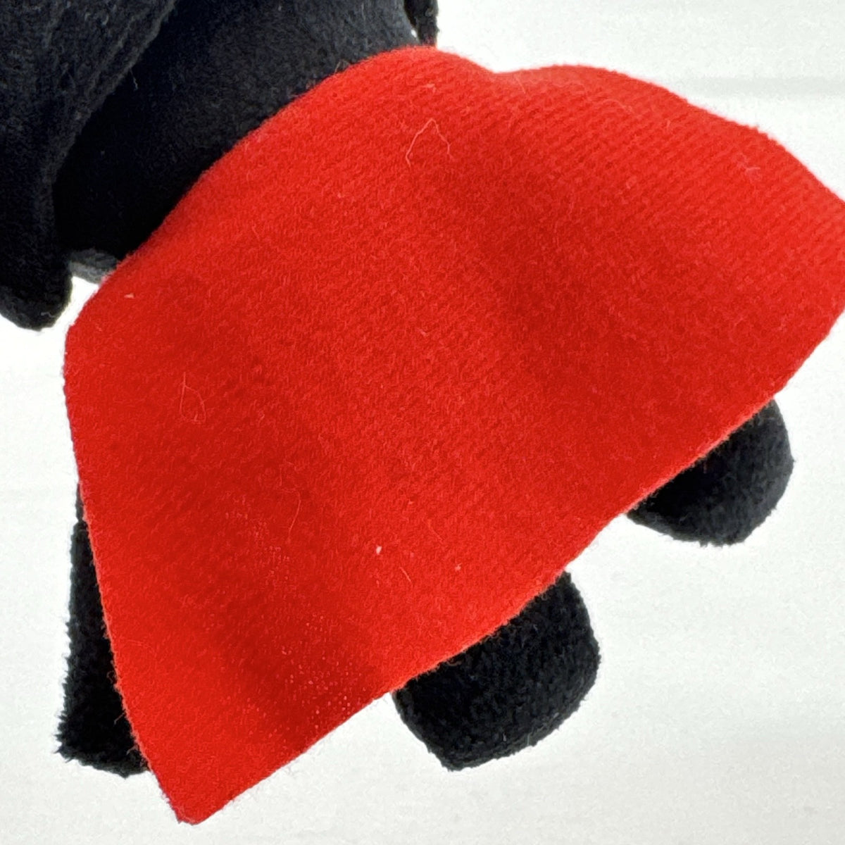 Star Wars holiday Darth Vader plush squeaker dog toy wearing a red Santa hat