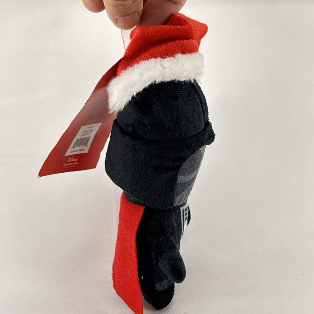 Star Wars holiday Darth Vader plush squeaker dog toy wearing a red Santa hat