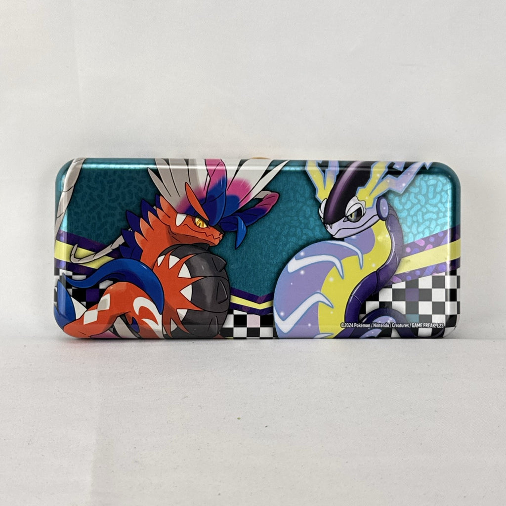 Pokémon 2024 embossed metal pencil tin featuring Charizard, Koraidon, and Miraidon