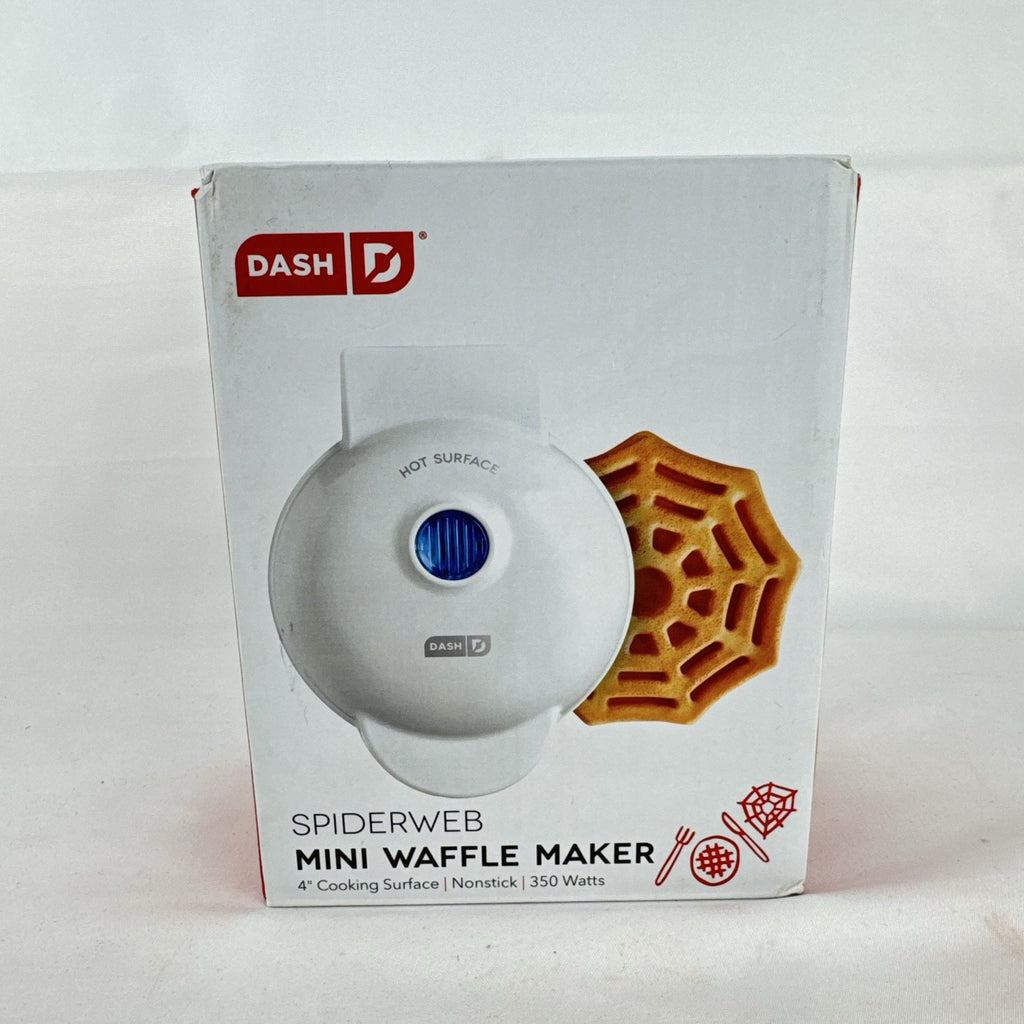 White Dash 4-inch mini waffle maker featuring an embossed Halloween spiderweb plate