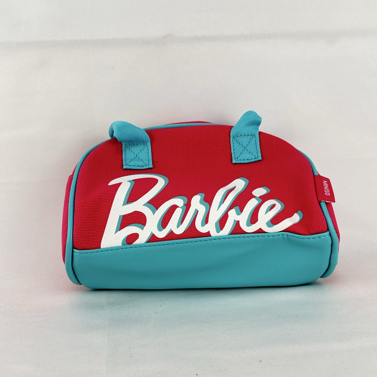 Miniso Barbie 65th Anniversary pink canvas mini duffle makeup bag with teal trim and top handles