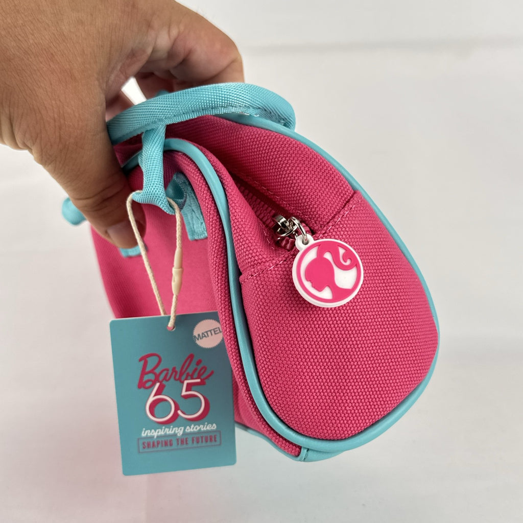 Miniso Barbie 65th Anniversary pink canvas mini duffle makeup bag with teal trim and top handles