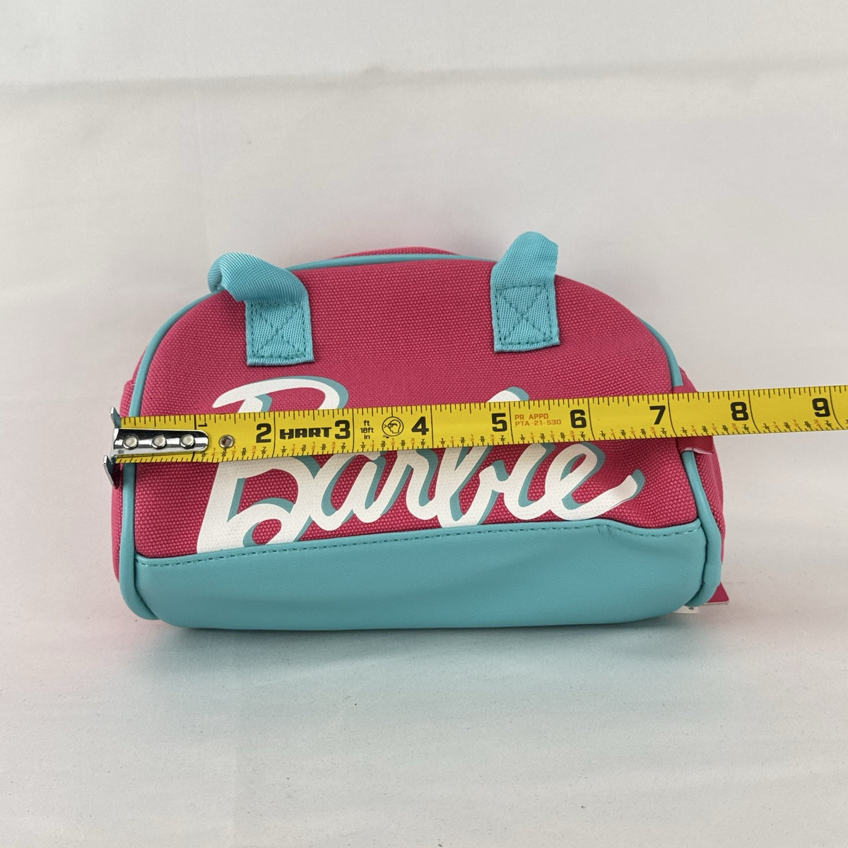 Miniso Barbie 65th Anniversary pink canvas mini duffle makeup bag with teal trim and top handles