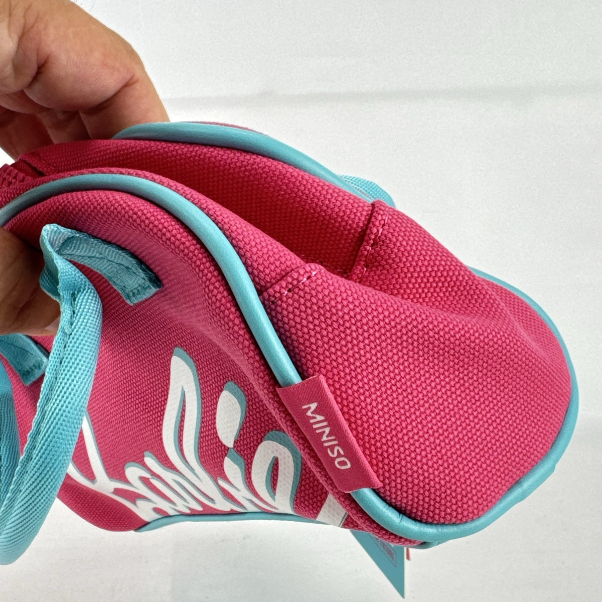 Miniso Barbie 65th Anniversary pink canvas mini duffle makeup bag with teal trim and top handles