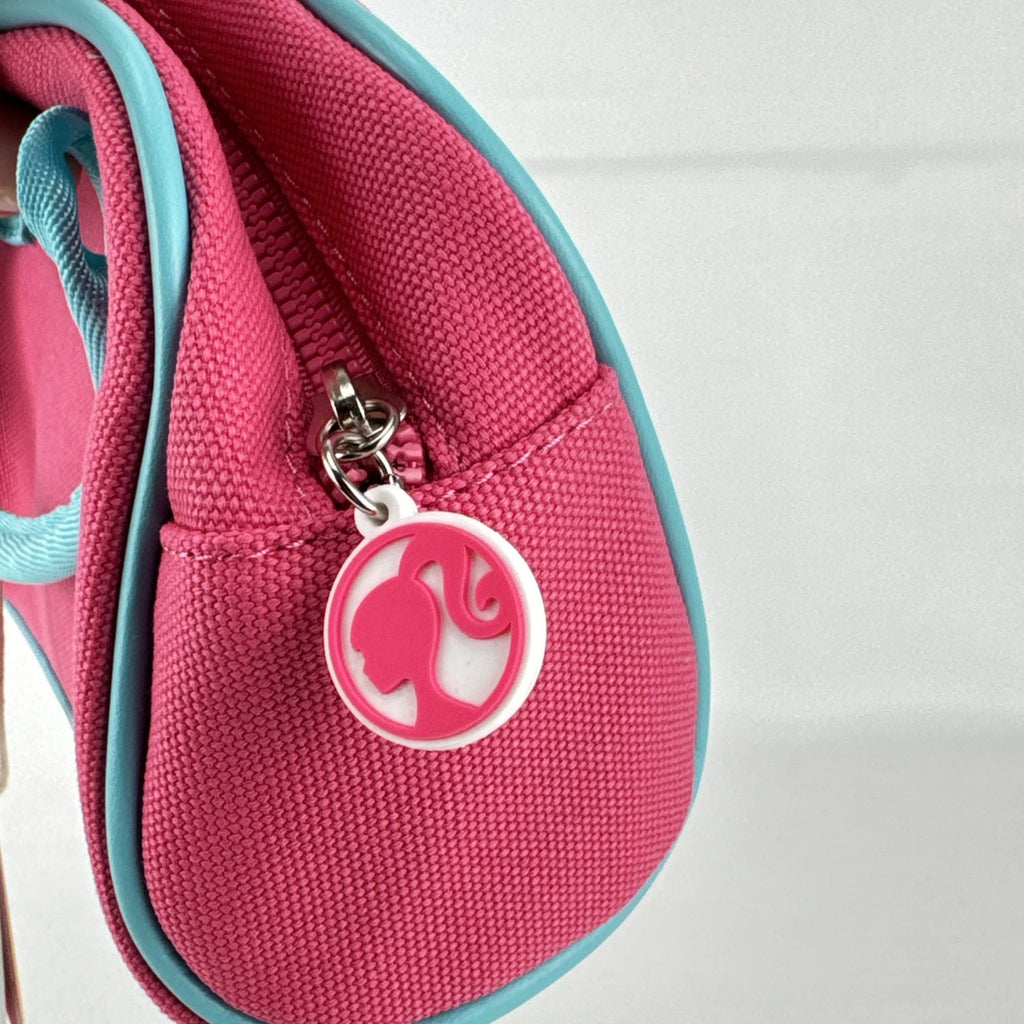 Miniso Barbie 65th Anniversary pink canvas mini duffle makeup bag with teal trim and top handles
