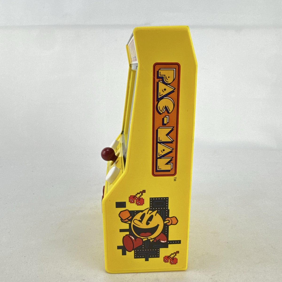 Basic Fun Pac-Man mini arcade cabinet handheld electronic game in yellow with LCD screen