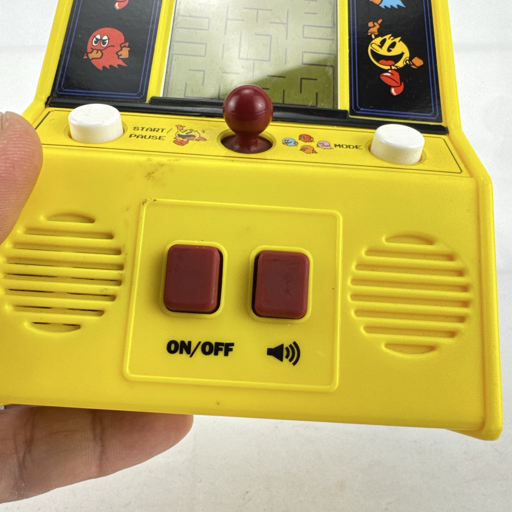 Basic Fun Pac-Man mini arcade cabinet handheld electronic game in yellow with LCD screen
