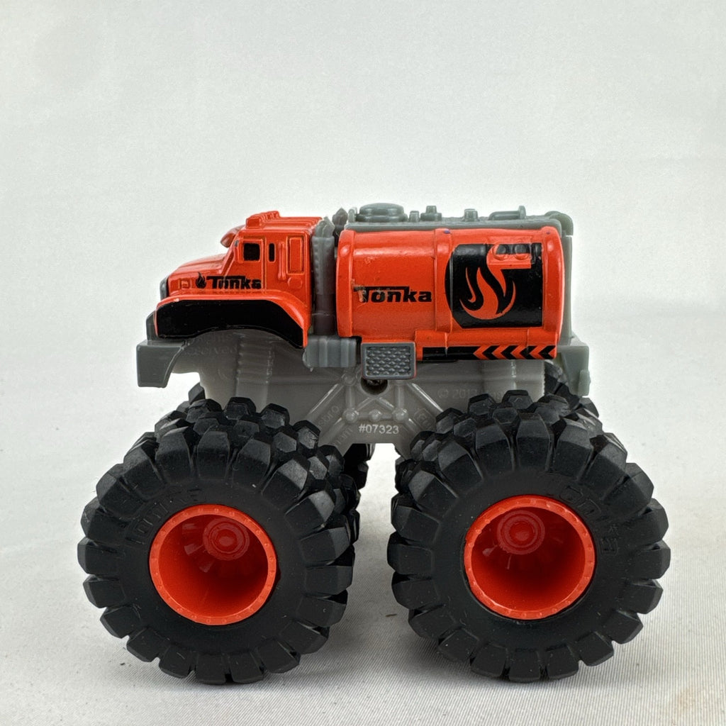 Tonka monster truck 8-wheel dually fuel tanker diecast vehicle in bright orange with flame graphics