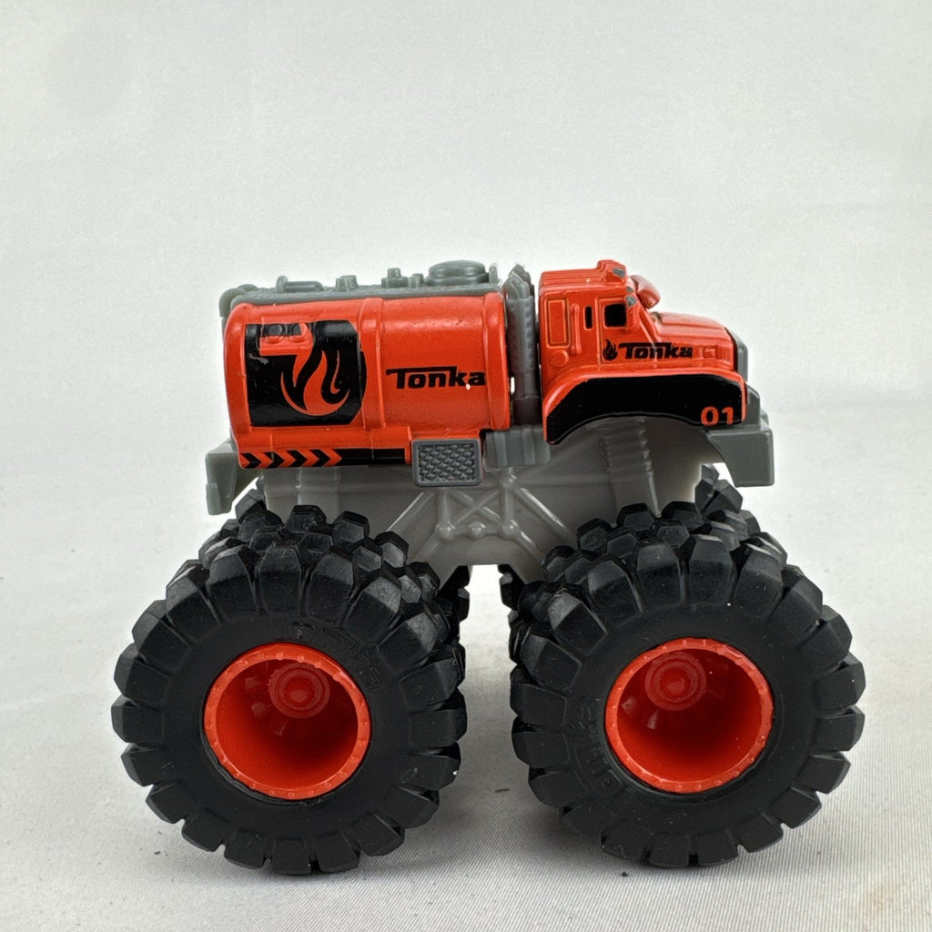 Tonka monster truck 8-wheel dually fuel tanker diecast vehicle in bright orange with flame graphics